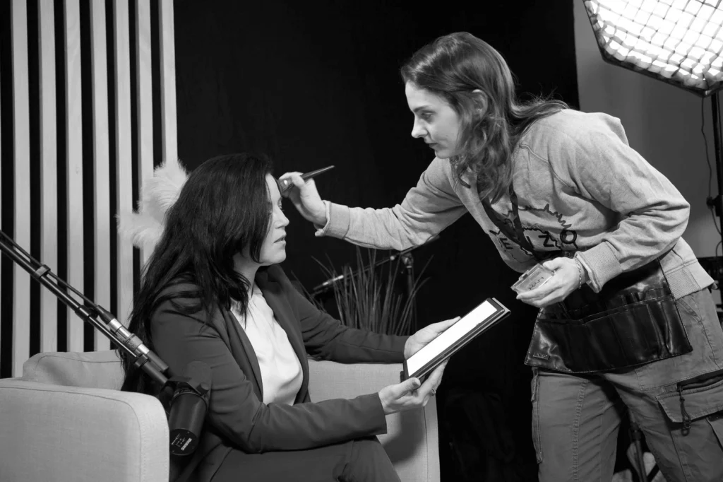 Cinema makeup artist Justine Fiorito at work on a film set.
